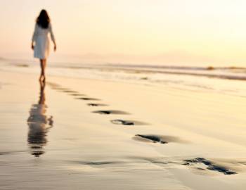 peaceful walk on the beach at dusk